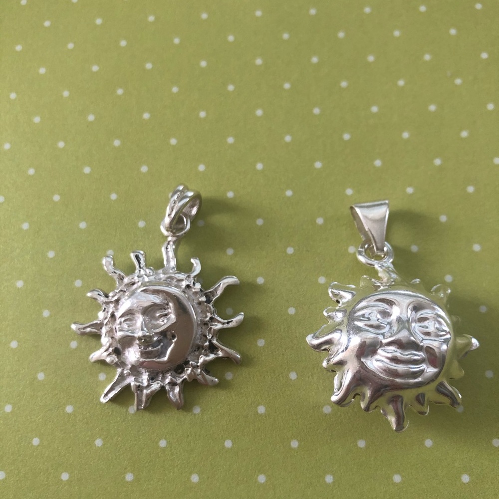 TWO sterling silver sun charms / pendants
